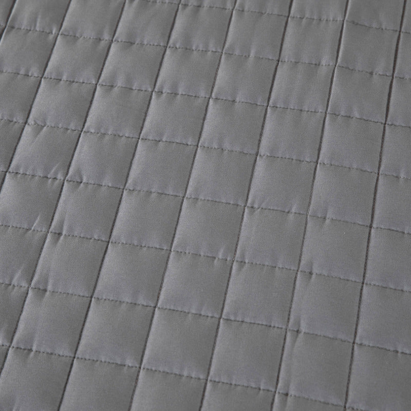 Détail de la piqûre d'une couverture lestée carrédoux